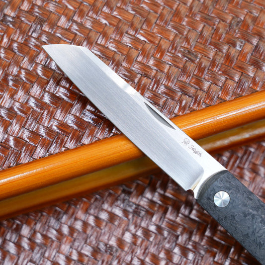 Production test Pocket knife with non-locking design, carbon fiber handle, M390, handmade satin finish.