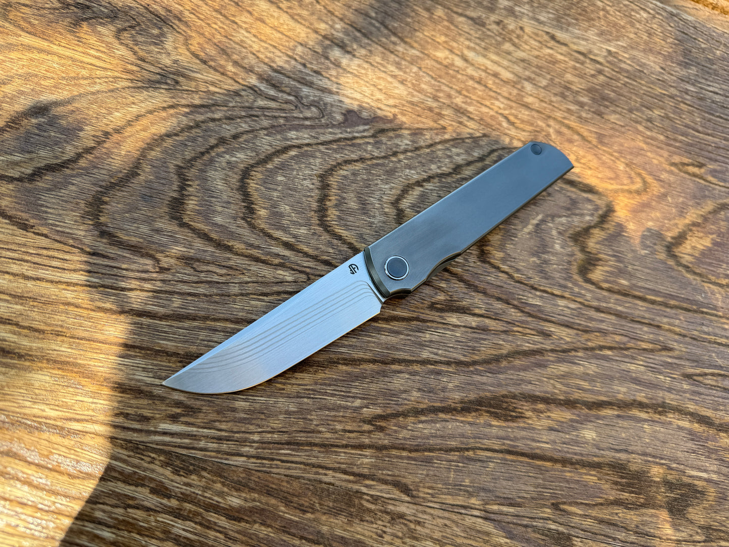 Salmon layered Damascus ZDP-189 core, titanium handle, titanium pocket clip, Japanese Kwaiken style