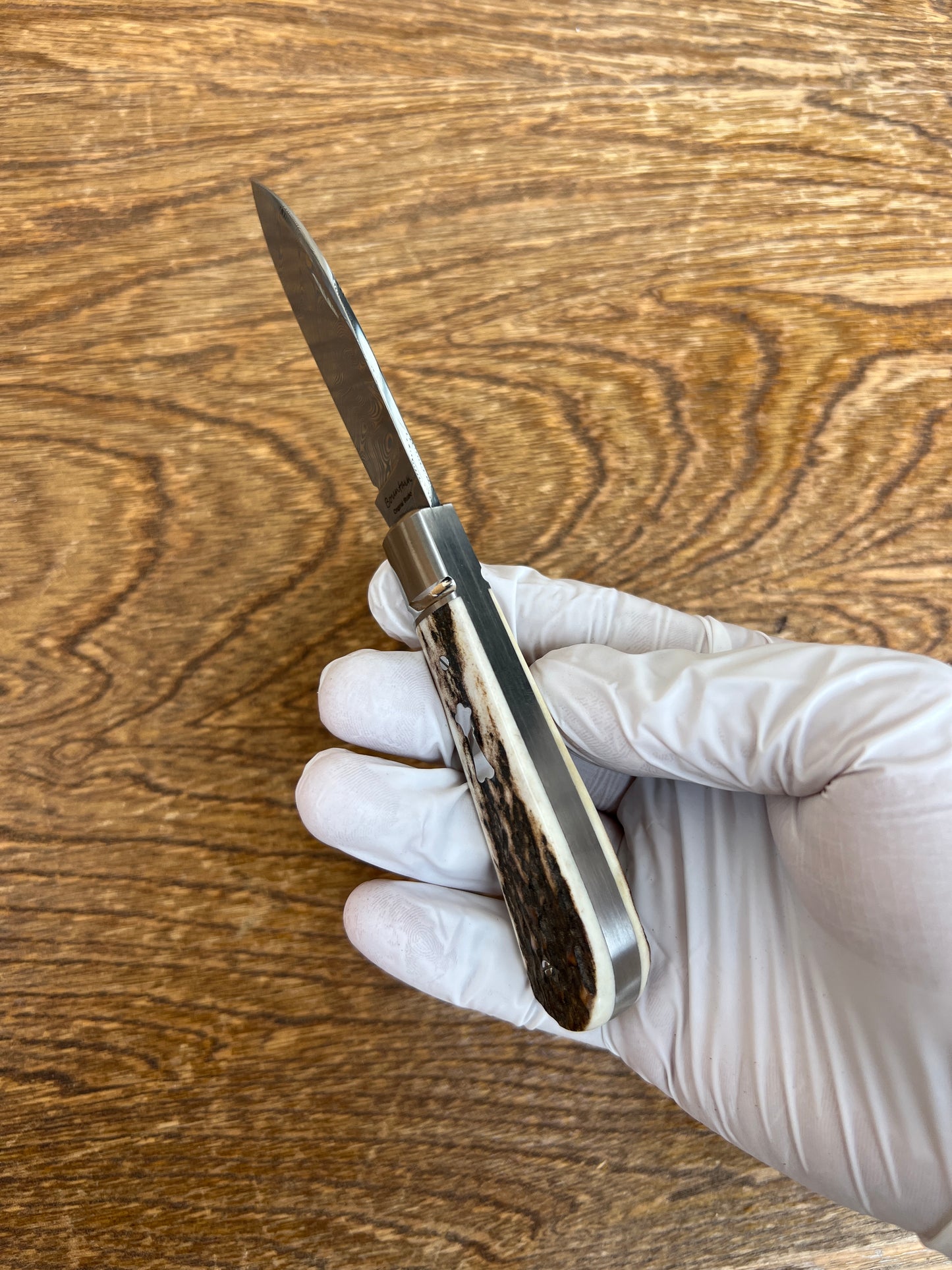 Couteau de poche traditionnel américain avec manche en bois de cerf zoulou, acier damassé, acier damassé suédois