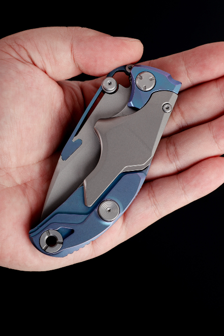 Multifunctional transforming folding knife, titanium , M390 steel.