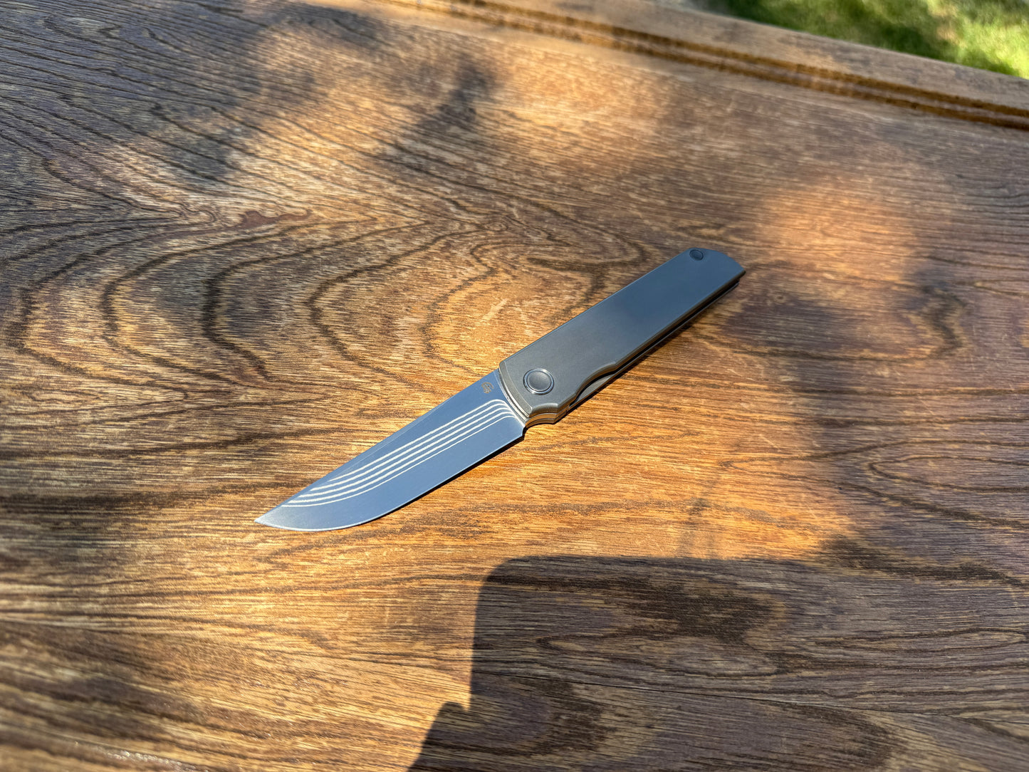 Salmon layered Damascus ZDP-189 core, titanium handle, titanium pocket clip, Japanese Kwaiken style