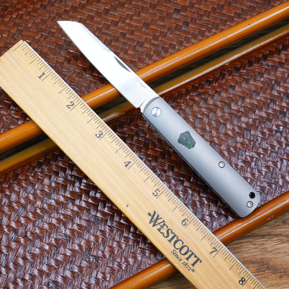 Production test Pocket knife with non-locking mechanism, titanium alloy handle, carbon fiber inlay, M390 hand-finished satin finish.