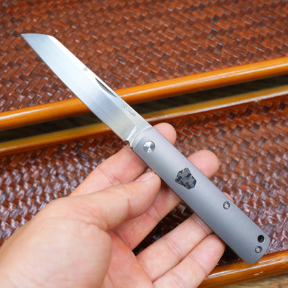 Production test Pocket knife with non-locking mechanism, titanium alloy handle, carbon fiber inlay, M390 hand-finished satin finish.