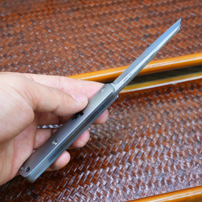 Production test Pocket knife with non-locking mechanism, titanium alloy handle, carbon fiber inlay, M390 hand-finished satin finish.