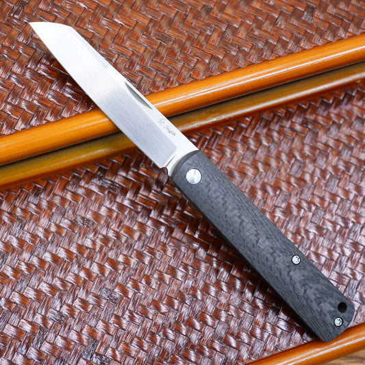 Production test Pocket knife with non-locking design, carbon fiber handle, M390, handmade satin finish.