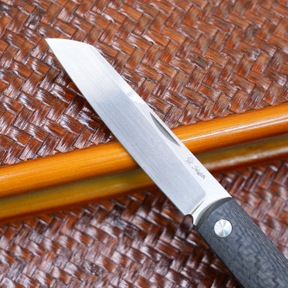 Production test Pocket knife with non-locking design, carbon fiber handle, M390, handmade satin finish.