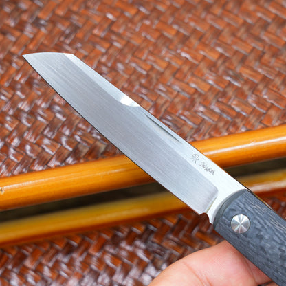 Production test Pocket knife with non-locking design, carbon fiber handle, M390, handmade satin finish.