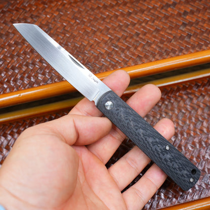 Production test Pocket knife with non-locking design, carbon fiber handle, M390, handmade satin finish.