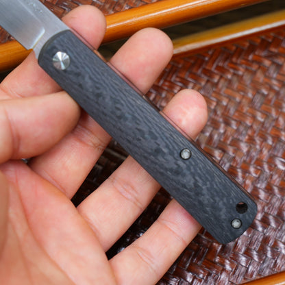 Production test Pocket knife with non-locking design, carbon fiber handle, M390, handmade satin finish.