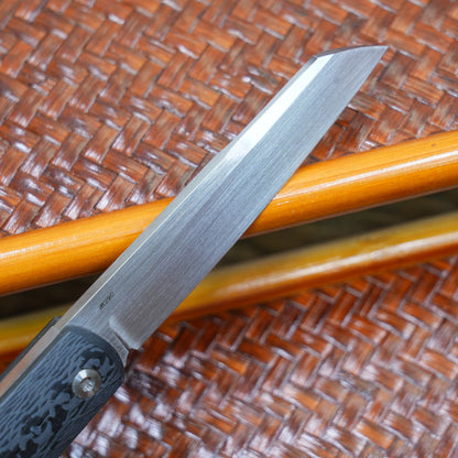 Production test Pocket knife with non-locking design, carbon fiber handle, M390, handmade satin finish.