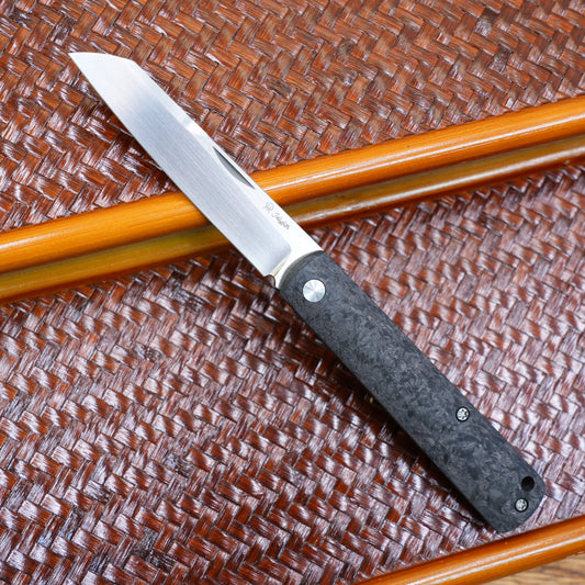 Production test Pocket knife with non-locking design, carbon fiber handle, M390, handmade satin finish.
