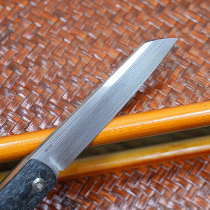 Production test Pocket knife with non-locking design, carbon fiber handle, M390, handmade satin finish.