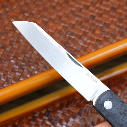 Production test Pocket knife with non-locking design, carbon fiber handle, M390, handmade satin finish.