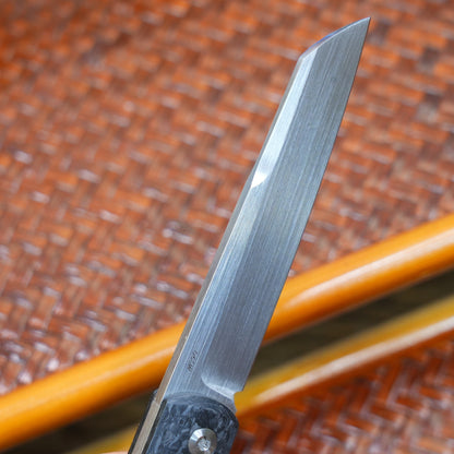 Production test Pocket knife with non-locking design, carbon fiber handle, M390, handmade satin finish.